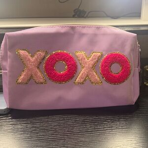 XOXO Purple Cosmetic Bag with Pink and Gold Accents